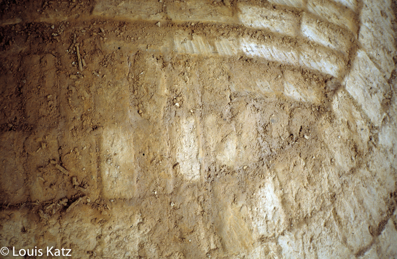 Where the arch meets the horseshoe courses near the firemouth.