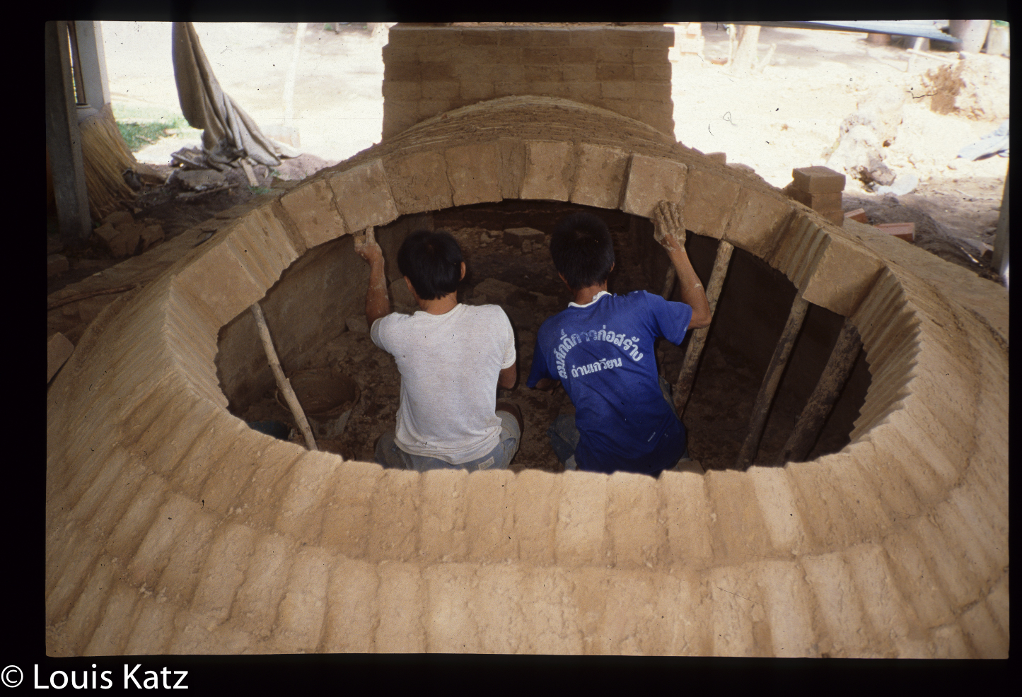 The rings these men are bricking lean back about 15-20˚. They are not perfectly vertical.